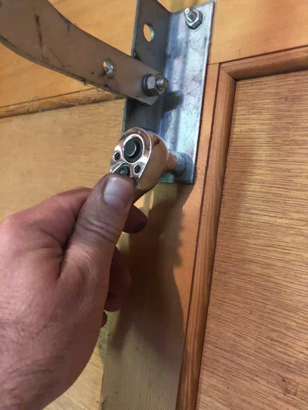 tightening garage door bolt